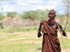 Turkana herder by gas flare
